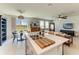 Spacious living space combines the kitchen, dining area, and living room into one large room at 7160 Amelia River Dr, Parrish, FL 34219