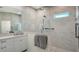 Bathroom showcasing double sinks, white countertops, tiled floors and a glass enclosed shower at 8239 Cypress Hollow Dr, Sarasota, FL 34238