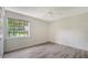 Bedroom featuring wood floors, natural light and a window view at 8239 Cypress Hollow Dr, Sarasota, FL 34238