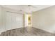 A bedroom featuring wood-look floors, a closet, and an open door to the ensuite bathroom at 8239 Cypress Hollow Dr, Sarasota, FL 34238