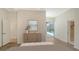 Bedroom featuring wood floors, ceiling fan and sliding glass doors leading to pool area at 8239 Cypress Hollow Dr, Sarasota, FL 34238