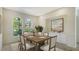 Elegant dining room with large windows and built-in cabinetry at 8239 Cypress Hollow Dr, Sarasota, FL 34238