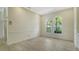Well lit dining room area featuring arched windows and a decorative area rug at 8239 Cypress Hollow Dr, Sarasota, FL 34238