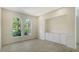 Bright dining room area with arched windows and built-in cabinetry at 8239 Cypress Hollow Dr, Sarasota, FL 34238