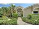Inviting front entrance with elegant double doors and lush greenery at 8239 Cypress Hollow Dr, Sarasota, FL 34238