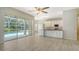 Bright kitchen features white cabinets, an island with breakfast bar, and stainless steel appliances at 8239 Cypress Hollow Dr, Sarasota, FL 34238