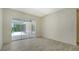 Light and airy living room area with a view of the lanai at 8239 Cypress Hollow Dr, Sarasota, FL 34238