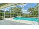 This screened-in pool offers the perfect spot to unwind and enjoy the beautiful Florida weather at 8239 Cypress Hollow Dr, Sarasota, FL 34238