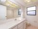 Bright bathroom features single sink, and tile flooring at 8260 Berkeley Manor Blvd, Spring Hill, FL 34606