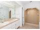 Bright bathroom features double sinks, spacious walk-in shower, and tile flooring at 8260 Berkeley Manor Blvd, Spring Hill, FL 34606