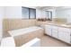 Bathroom with dual vanity sinks, and tub at 8260 Berkeley Manor Blvd, Spring Hill, FL 34606