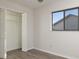 Bedroom with closet and window for natural light and outdoor views at 8260 Berkeley Manor Blvd, Spring Hill, FL 34606