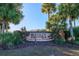 Entrance to Berkeley Manor, a deed-restricted community with lush landscaping at 8260 Berkeley Manor Blvd, Spring Hill, FL 34606
