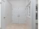 Inviting entryway with double doors, tiled floor, and natural light at 8260 Berkeley Manor Blvd, Spring Hill, FL 34606