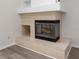 Elegant tile fireplace with glass door and a built-in nook, perfect for cozy evenings at 8260 Berkeley Manor Blvd, Spring Hill, FL 34606
