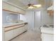 Well-lit kitchen featuring classic white cabinetry and appliances with ample counter space at 8260 Berkeley Manor Blvd, Spring Hill, FL 34606