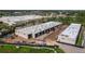 Aerial view of new commercial buildings in development surrounded by green space and parking at 829 57Th E St, Bradenton, FL 34208
