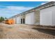 Newly constructed warehouse bays with loading docks and grey rollup doors at 829 57Th E St, Bradenton, FL 34208