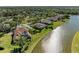 Aerial view of waterfront homes showing screened-in pools and water views at 8315 Eagle Xing, Sarasota, FL 34241