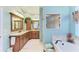 Bathroom with double vanity, soaking tub, and separate shower at 8315 Eagle Xing, Sarasota, FL 34241