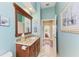 Bathroom showcasing a vanity with granite countertop, wood cabinets, and custom décor at 8315 Eagle Xing, Sarasota, FL 34241