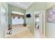 Bright bathroom featuring a soaking tub, elegant fixtures, and a television at 8315 Eagle Xing, Sarasota, FL 34241