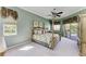 Comfortable bedroom with natural light, ceiling fan, and serene ambiance with pool access at 8315 Eagle Xing, Sarasota, FL 34241