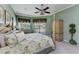 Bright bedroom with a view of the pool area and a comfortable four-poster bed at 8315 Eagle Xing, Sarasota, FL 34241