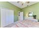 Comfortable bedroom with carpeted floors, large closet, and cottage style furniture at 8315 Eagle Xing, Sarasota, FL 34241