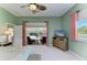 Primary bedroom featuring an ensuite, water view, and access to lanai at 8315 Eagle Xing, Sarasota, FL 34241