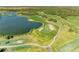 Overhead shot of the golf course, highlighting the water features, sand traps, and greens at 8315 Eagle Xing, Sarasota, FL 34241