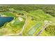 Picturesque aerial view of the golf course showcasing the rolling greens, sand traps, and scenic layout at 8315 Eagle Xing, Sarasota, FL 34241