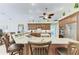 Beautiful kitchen features granite countertops, custom wood cabinets, an island with seating, and stainless steel appliances at 8315 Eagle Xing, Sarasota, FL 34241