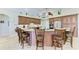 Spacious kitchen with wooden cabinets, granite counters, stainless steel appliances, and counter seating at the island at 8315 Eagle Xing, Sarasota, FL 34241