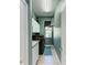 Laundry room with front loading washer and dryer, overhead rack, and sink at 8315 Eagle Xing, Sarasota, FL 34241
