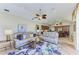 Comfortable living room open to the kitchen, with ceiling fan and stylish decor at 8315 Eagle Xing, Sarasota, FL 34241