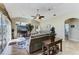 Bright living room with vaulted ceilings, cozy seating, and sliding glass doors to outdoor area at 8315 Eagle Xing, Sarasota, FL 34241
