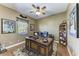 Home office featuring a large wooden desk, comfortable chair, and built-in shelving at 8315 Eagle Xing, Sarasota, FL 34241