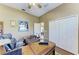 Home office features a large wooden desk with closet and vaulted ceilings at 8315 Eagle Xing, Sarasota, FL 34241