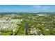 Stunning aerial view of the property, surrounded by lush greenery, showcasing its prime location at 891 Faulkwood Ct, Sarasota, FL 34232
