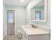Bathroom featuring a modern vanity with granite counters and mirror at 891 Faulkwood Ct, Sarasota, FL 34232