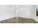 Bright bedroom features wood flooring, white walls, and ceiling fan at 891 Faulkwood Ct, Sarasota, FL 34232