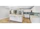 Bright, spacious kitchen with white cabinets, a large island, and stainless steel appliances at 891 Faulkwood Ct, Sarasota, FL 34232