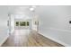 Expansive living room with modern flooring and an open layout, ideal for comfortable living at 891 Faulkwood Ct, Sarasota, FL 34232