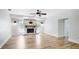 Spacious living room with a modern fireplace and hardwood flooring at 891 Faulkwood Ct, Sarasota, FL 34232