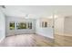 Inviting living room with ample natural light, wood-style floors, and a cozy atmosphere at 891 Faulkwood Ct, Sarasota, FL 34232