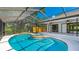 Enjoy this covered pool and spa with backyard views, perfect for relaxing and entertaining at 891 Faulkwood Ct, Sarasota, FL 34232