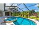 Inviting screened-in pool area with spa, perfect for relaxation and outdoor entertainment at 891 Faulkwood Ct, Sarasota, FL 34232
