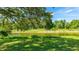 Picturesque waterfront view with lush trees and greenery, offering a serene and natural backdrop at 891 Faulkwood Ct, Sarasota, FL 34232