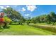 Scenic backyard with lush greenery and waterfront views, perfect for relaxation and tranquility at 891 Faulkwood Ct, Sarasota, FL 34232